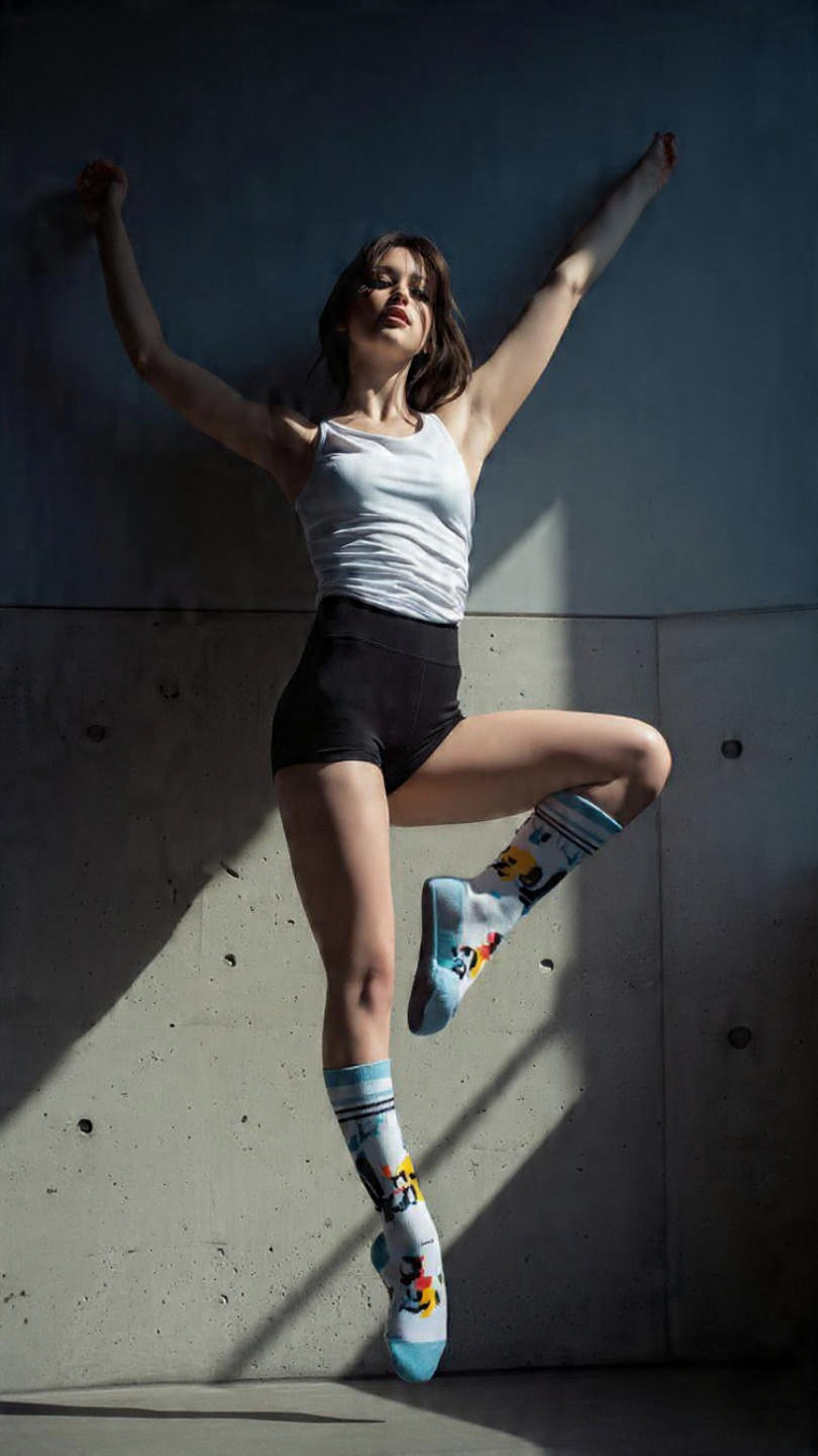 a sporty sock design on a girl wearing it in a spo